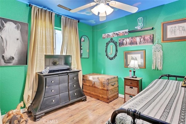 bedroom featuring ceiling fan and wood-type flooring