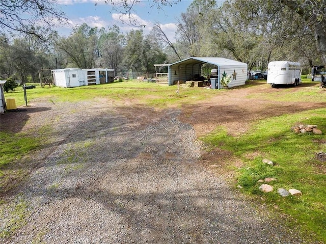 view of yard featuring a carport