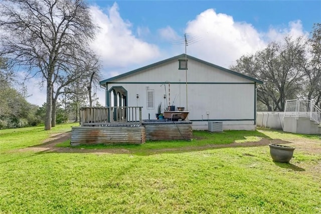 rear view of house with a lawn