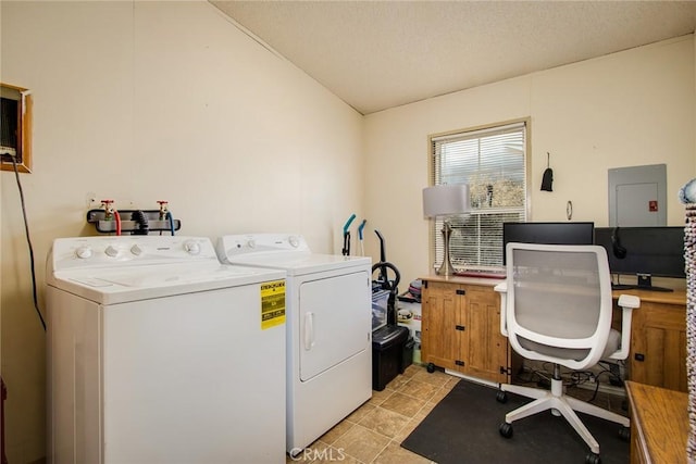 clothes washing area featuring washer and dryer and light tile patterned floors