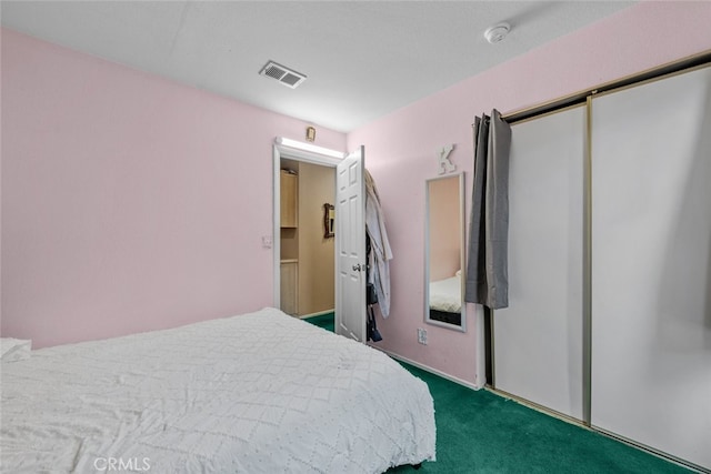 carpeted bedroom featuring a closet