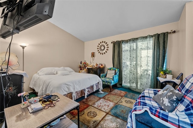 bedroom featuring vaulted ceiling