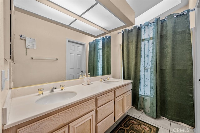 bathroom with shower / tub combo, vanity, and tile patterned flooring