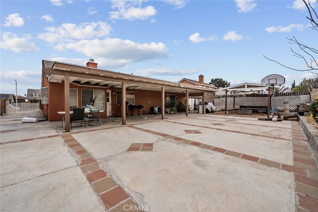 rear view of house with a patio