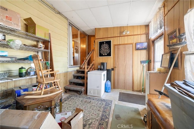 miscellaneous room with wood walls