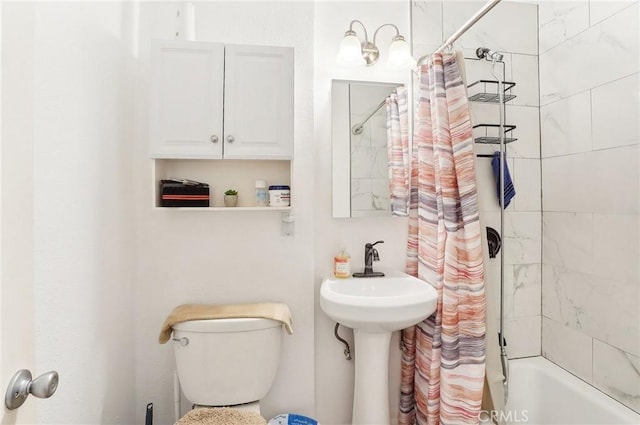 bathroom with toilet and shower / bath combo