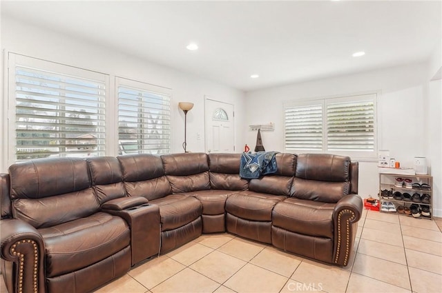 tiled living room featuring a wealth of natural light