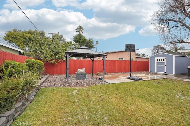 view of yard with a storage shed, a gazebo, and a patio