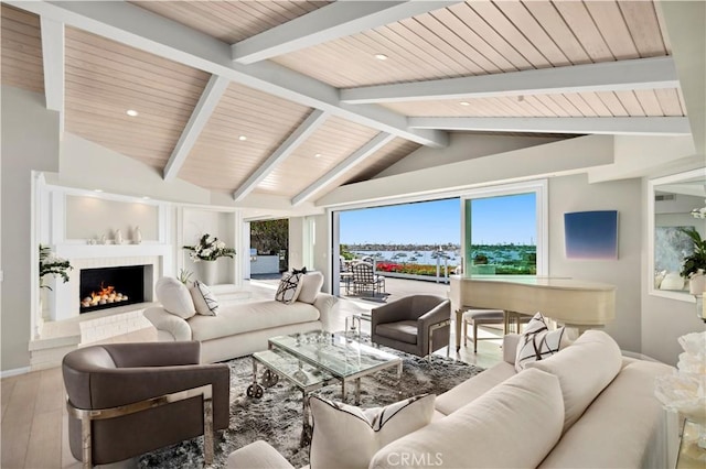 living room featuring hardwood / wood-style flooring, vaulted ceiling with beams, a brick fireplace, and wooden ceiling