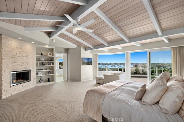 bedroom with vaulted ceiling with beams, wooden ceiling, carpet floors, and a fireplace