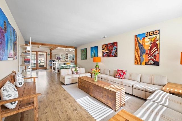 living room with light hardwood / wood-style flooring