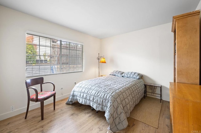 bedroom with light hardwood / wood-style floors