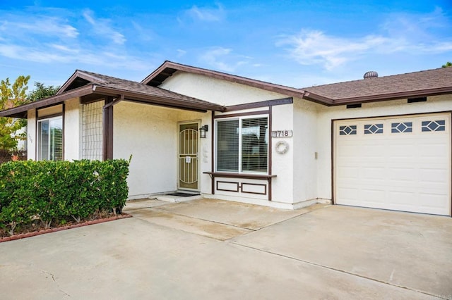 ranch-style home with a garage