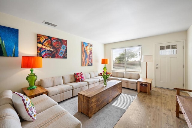 living room with light hardwood / wood-style floors