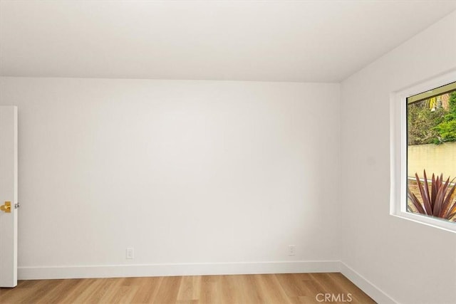 empty room with light hardwood / wood-style floors