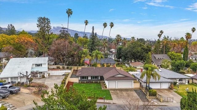 birds eye view of property with a mountain view