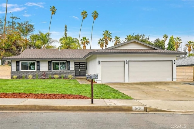 single story home with a garage, french doors, and a front lawn