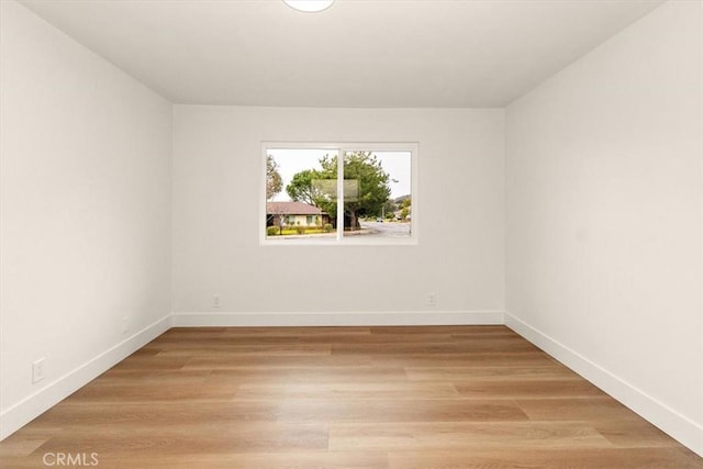 spare room with light wood-type flooring