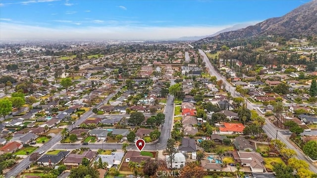 birds eye view of property with a mountain view