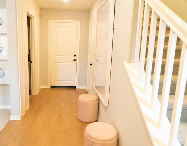 corridor with light wood-type flooring