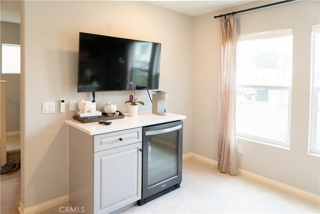 bar featuring white cabinetry and wine cooler