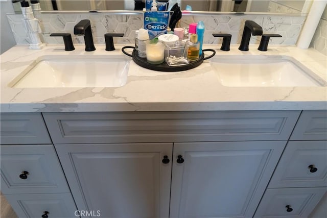 interior details featuring tasteful backsplash and vanity