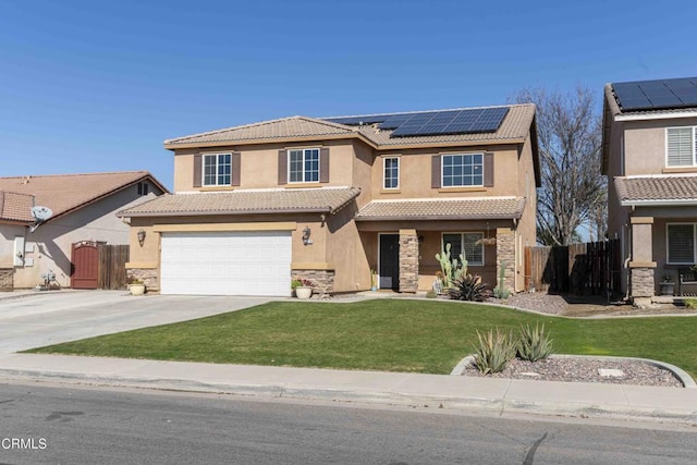 view of front of home featuring a garage, a front lawn, and solar panels