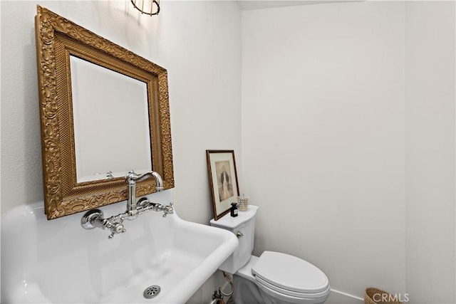 bathroom with sink and toilet