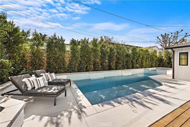 view of pool with an in ground hot tub