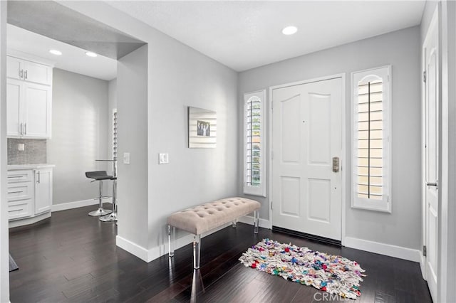 entrance foyer with dark hardwood / wood-style flooring