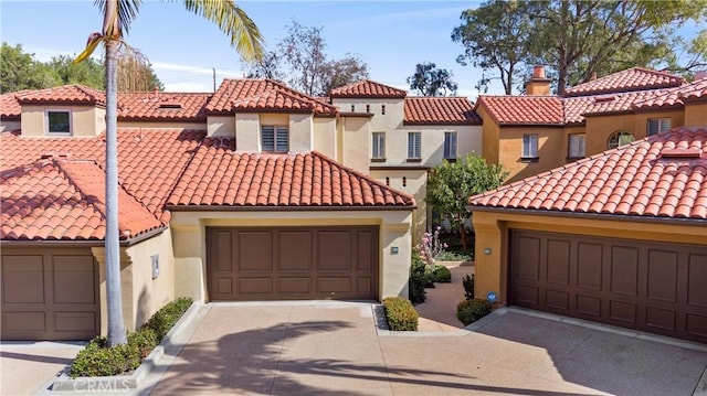 mediterranean / spanish-style house featuring a garage