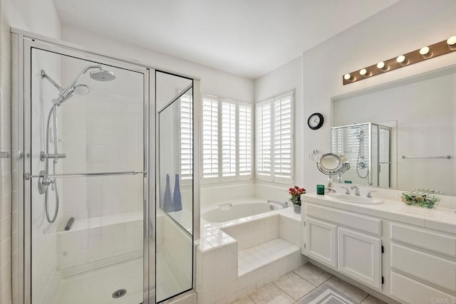 bathroom featuring plus walk in shower, tile patterned floors, and vanity