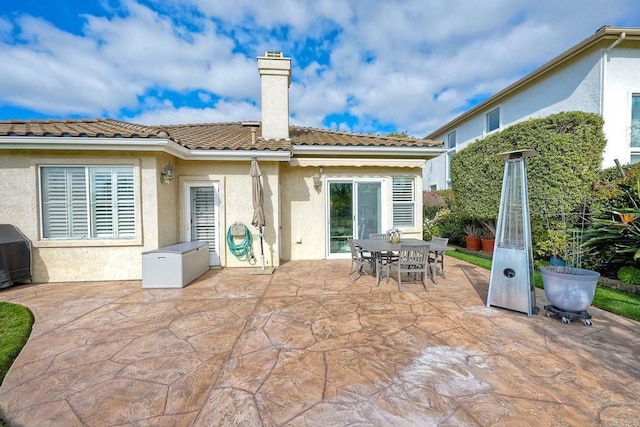 rear view of house with a patio