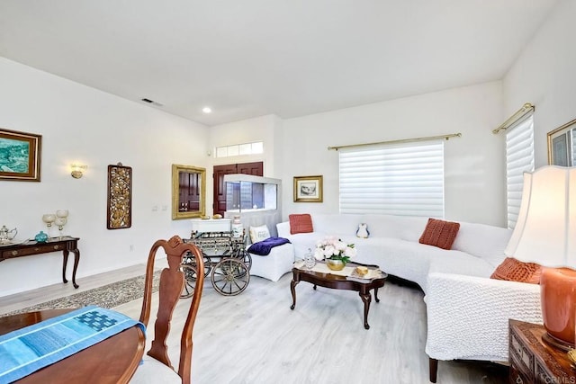 living room with light hardwood / wood-style flooring