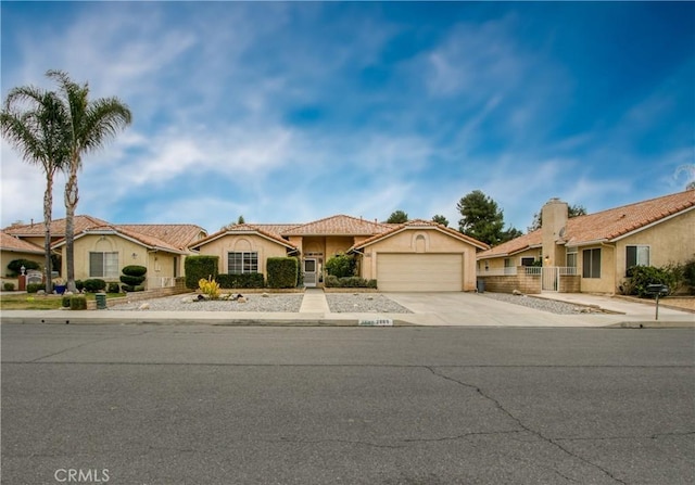 2869 Maple Dr, Hemet, CA 92545 - mediterranean / spanish-style house with an attached garage, driveway, and stucco siding