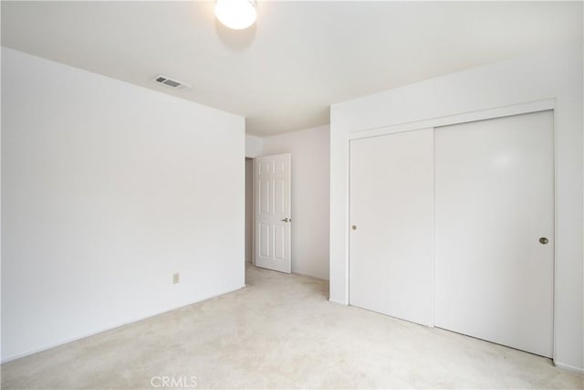 2869 Maple Dr, Hemet, CA 92545 - unfurnished bedroom featuring light colored carpet and a closet