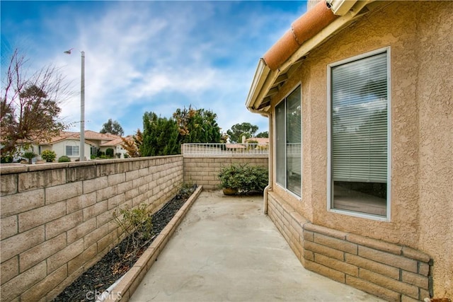 2869 Maple Dr, Hemet, CA 92545 - view of home's exterior with a patio, a fenced backyard, and stucco siding