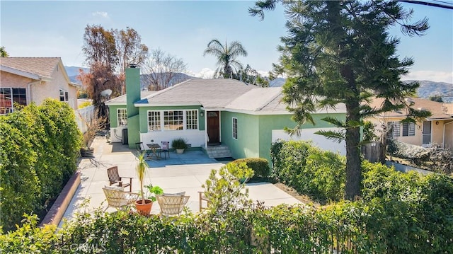 back of property featuring a patio area