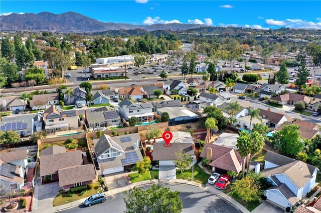 birds eye view of property with a mountain view