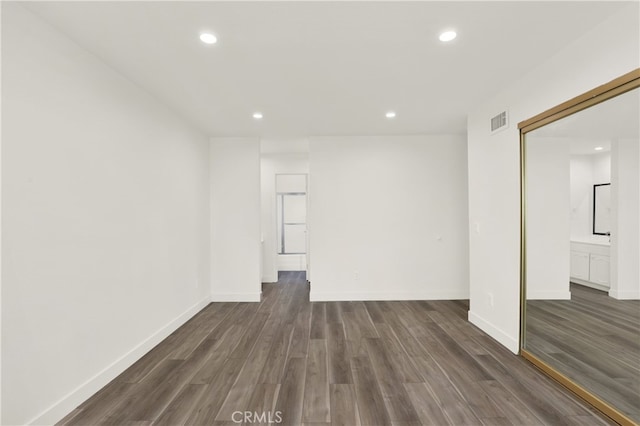 spare room featuring dark wood-type flooring