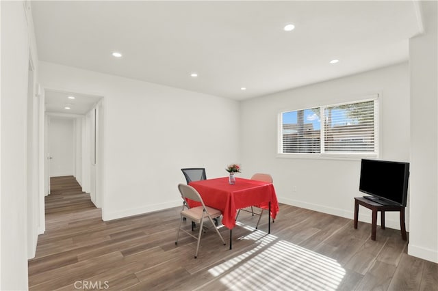 dining space with dark hardwood / wood-style floors