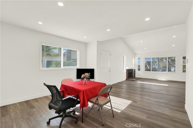 dining space with hardwood / wood-style floors