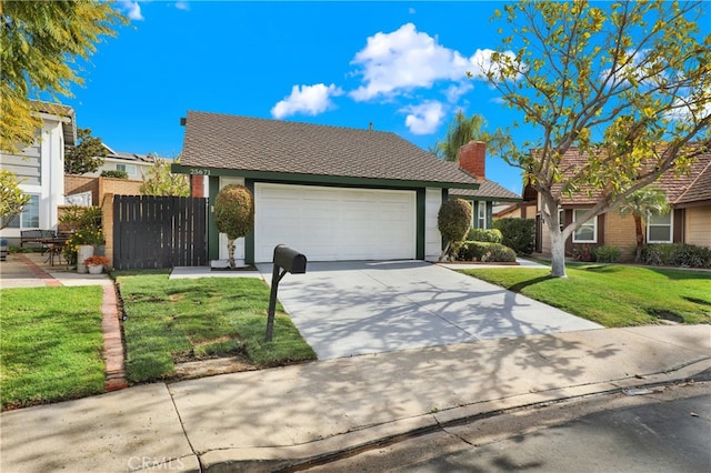 view of front facade featuring a garage and a front lawn