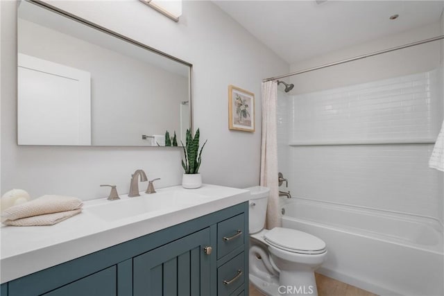 full bathroom with vanity, shower / tub combo, and toilet