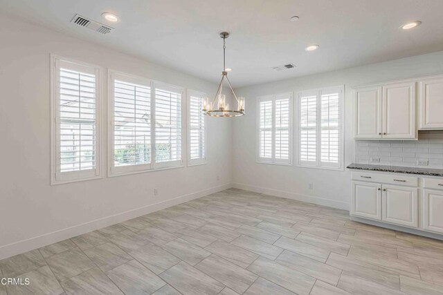 14706 Pemberley Passage Ave, Bakersfield, CA 93311 - unfurnished dining area featuring a chandelier