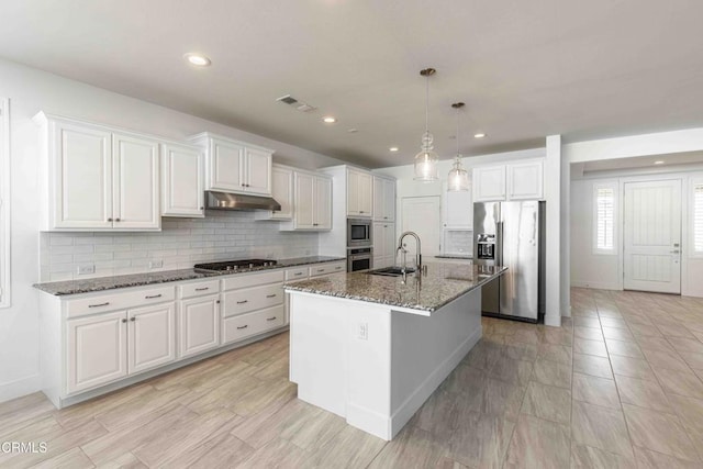 14706 Pemberley Passage Ave, Bakersfield, CA 93311 - kitchen featuring appliances with stainless steel finishes, sink, white cabinets, and dark stone counters