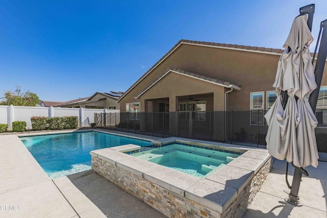 14706 Pemberley Passage Ave, Bakersfield, CA 93311 - view of swimming pool featuring an in ground hot tub and a patio area