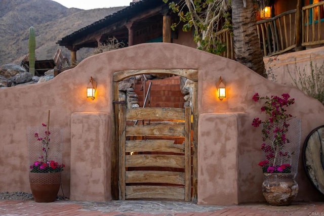 view of gate with a mountain view