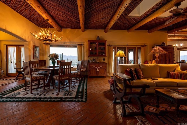 dining room with wooden ceiling, an inviting chandelier, beamed ceiling, and french doors