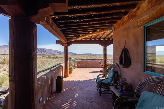 view of patio / terrace with a mountain view